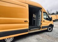 Yellow Ford Transit van with open side and rear doors, showing cargo area.