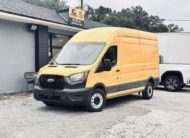 Yellow Ford Transit van parked outside Box Trucks Sales Rental.