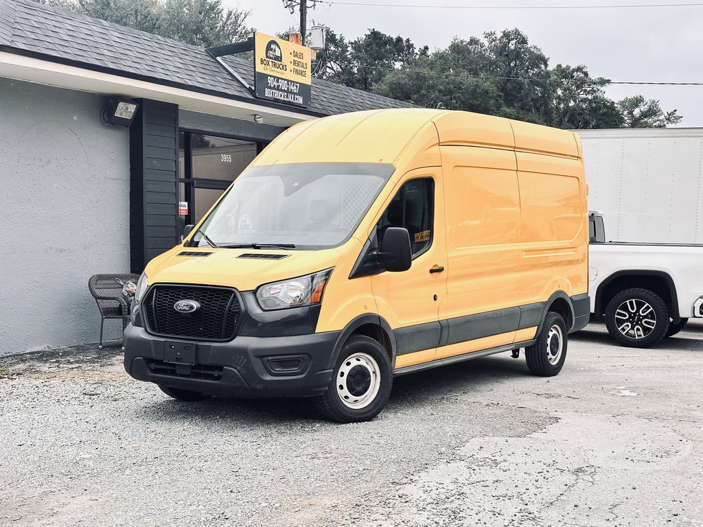Yellow Ford Transit van parked outside Box Trucks Sales Rental.