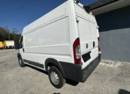 White Ram ProMaster cargo van parked outdoors, rear view