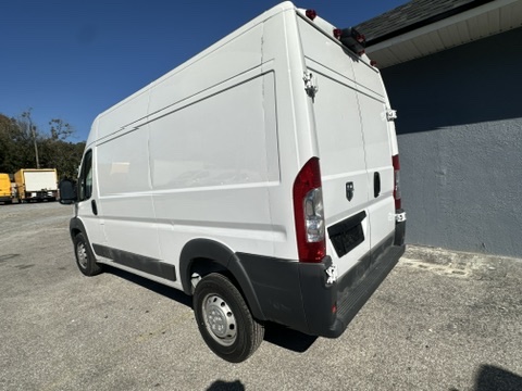 White Ram ProMaster cargo van parked outdoors, rear view