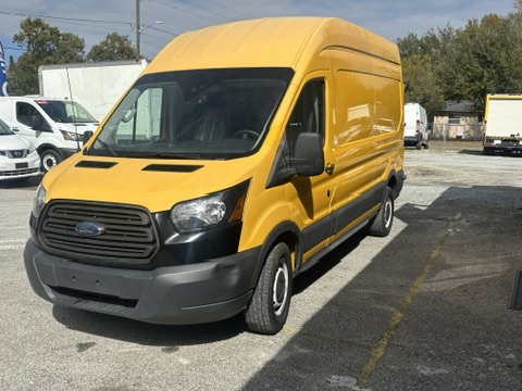 Yellow Ford Transit van parked on asphalt lot