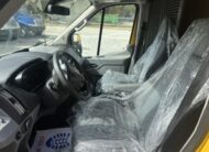 Interior of a yellow van with plastic-covered seats and dashboard.