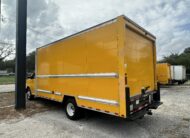 Rear view of a yellow 2020 GMC Savana 3500 16ft box truck.