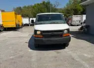 Front view of a white 2009 Chevy G2500 cargo van parked outdoors