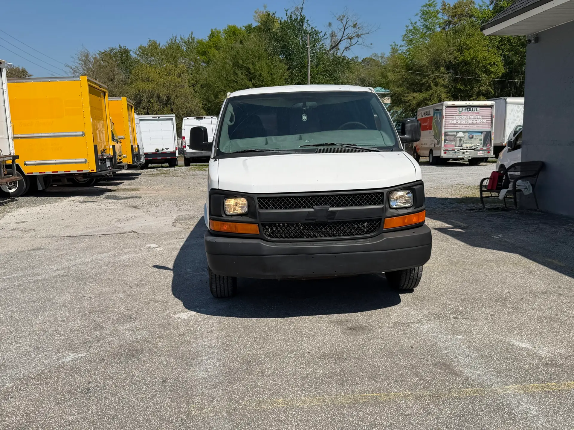 Front view of a white 2009 Chevy G2500 cargo van parked outdoors