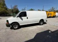 White 2009 Chevy G2500 cargo van parked outdoors on a sunny day.