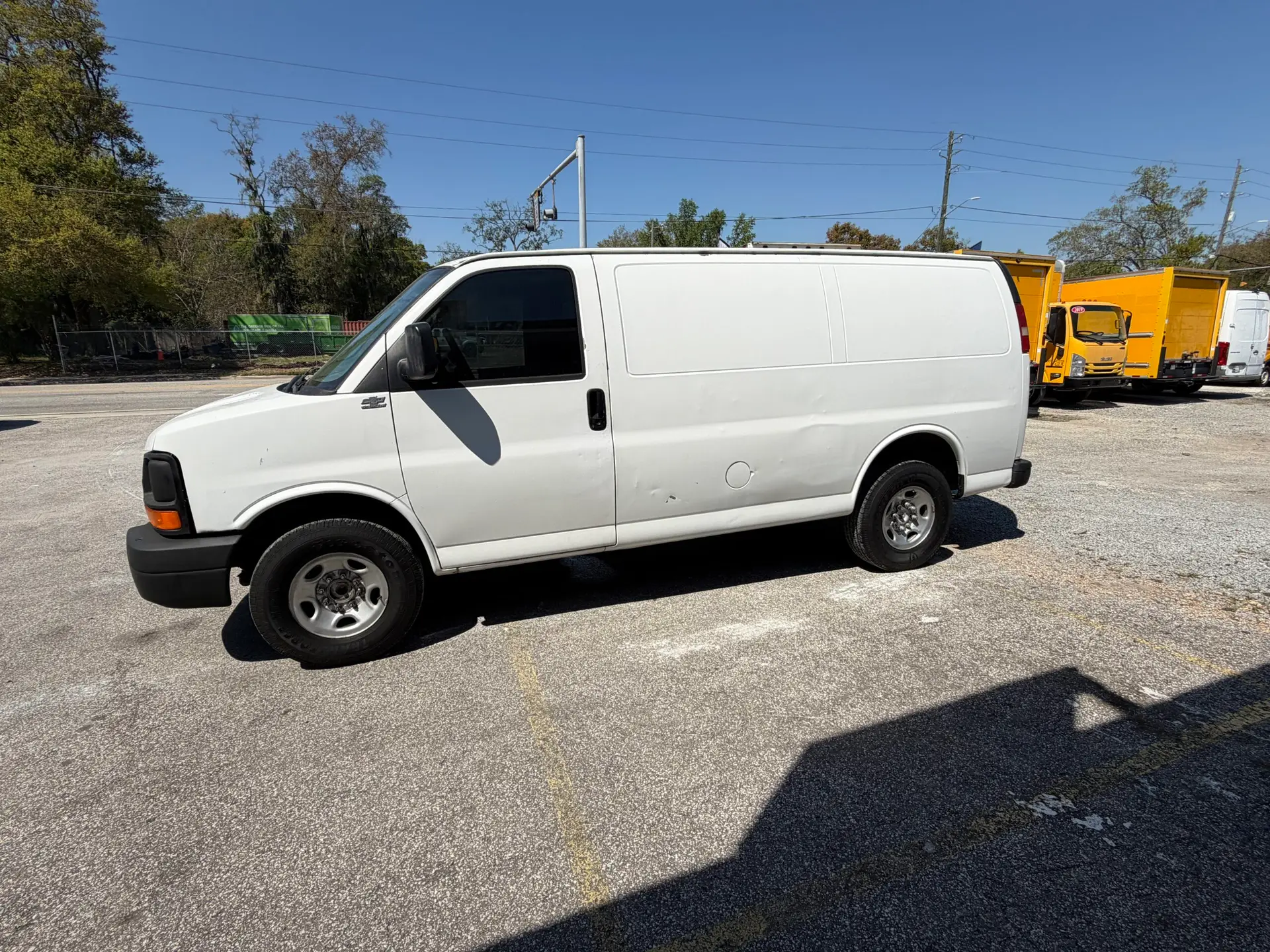 White 2009 Chevy G2500 cargo van parked outdoors on a sunny day.