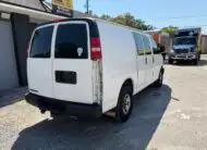Rear view of a white 2009 Chevy G2500 cargo van for sale at Box Trucks Jax.