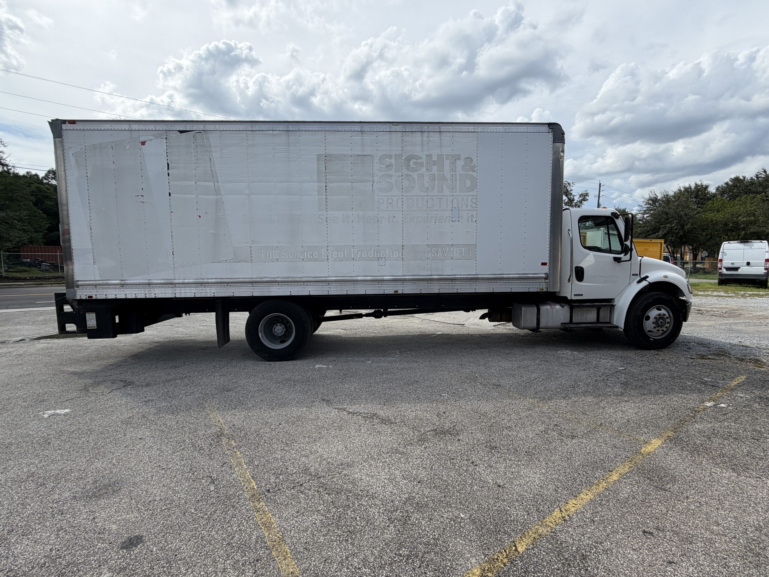 2007 Freightliner M2 box truck with liftgate, featuring "Sight & Sound Productions" logo.