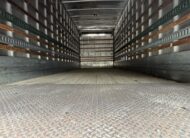 Interior of a 2007 Freightliner M2 box truck, showing the empty cargo area.