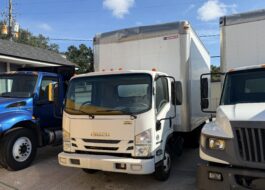 Front view of a white 2019 Isuzu NQR 16ft diesel box truck.
