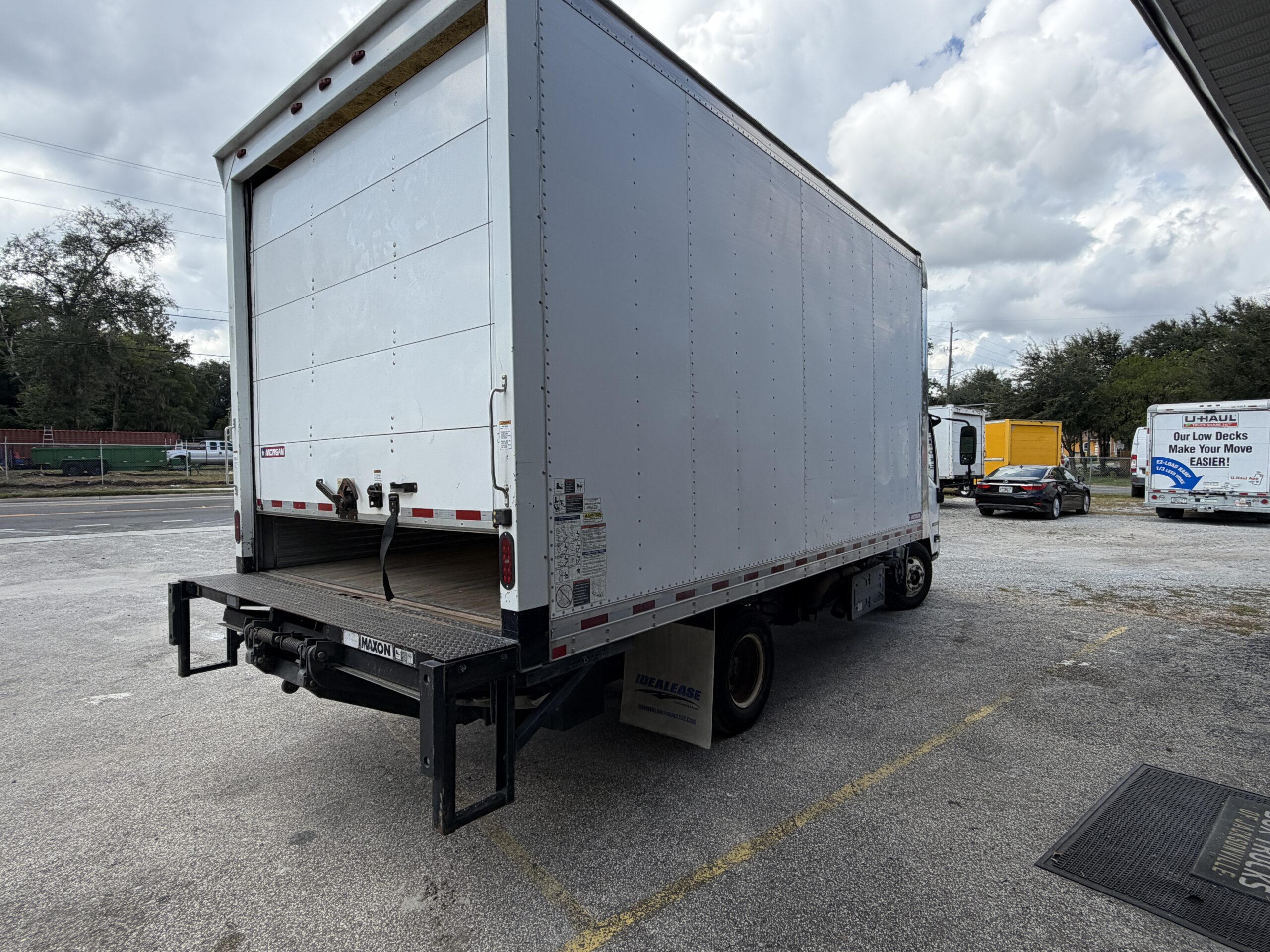 Rear view of a 2019 Isuzu NQR 16ft. diesel box truck with liftgate