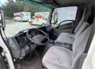 Interior of a 2019 Isuzu NQR 16ft. diesel box truck, showing the driver's seat and dashboard.