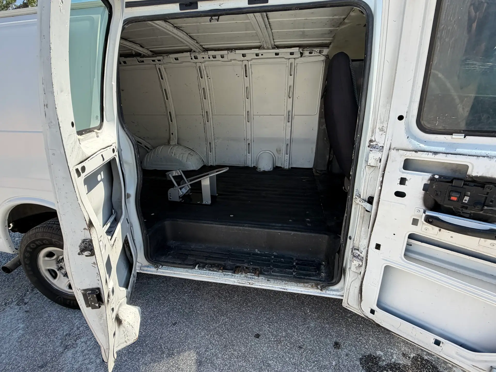 Interior of a 2009 Chevy G2500 cargo van, showing empty cargo space.