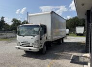 2020 Isuzu NRR 20ft. box truck with liftgate parked outside.