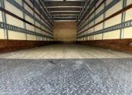 Interior of a 20ft. box truck, showing the cargo area with tie-down rails.