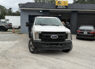 2019 Ford F-550 Super Duty stake body truck in lot
