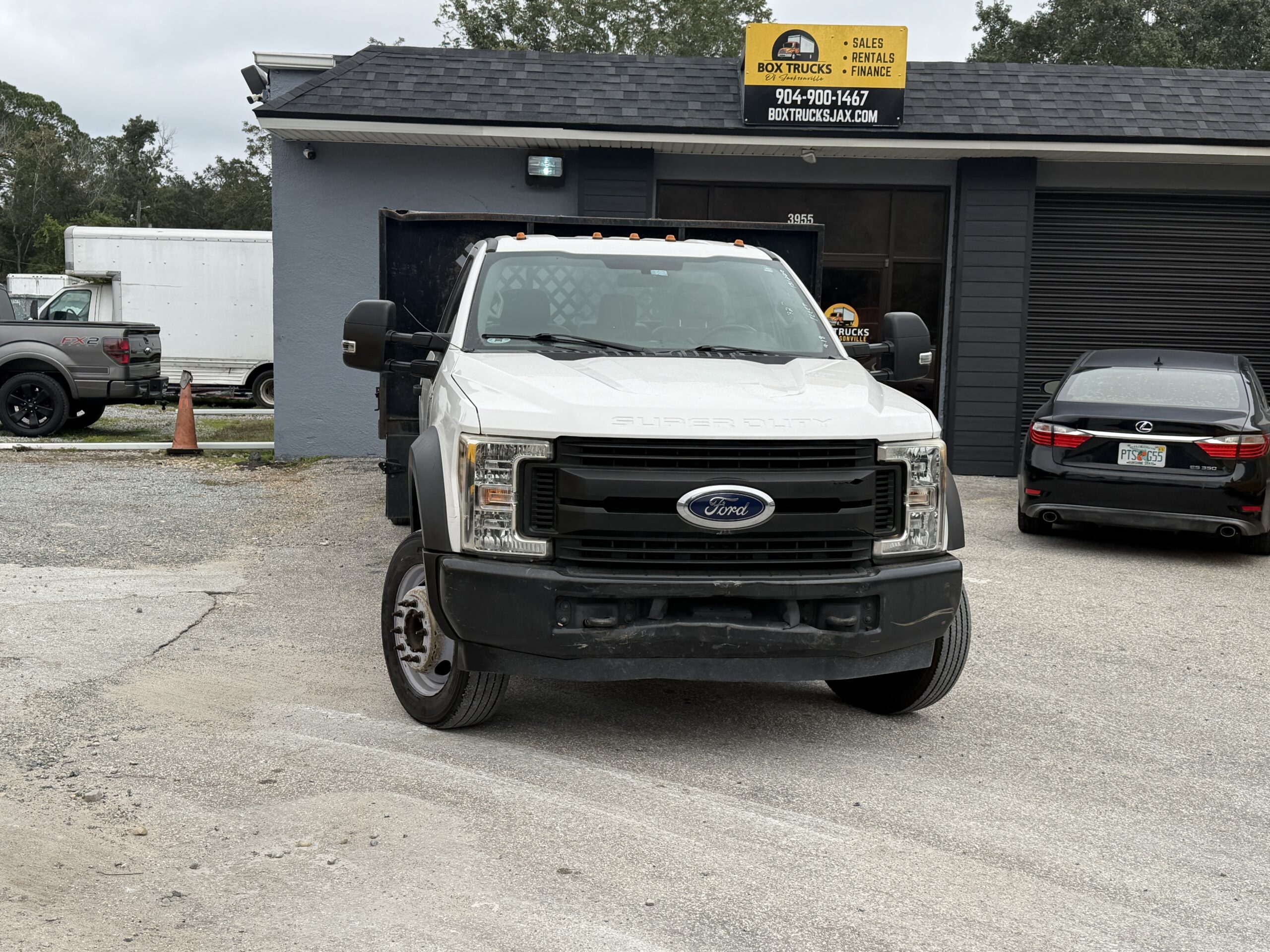 2019 Ford F-550 Super Duty stake body truck in lot