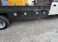 2019 Ford F-550 stake body truck with storage compartments