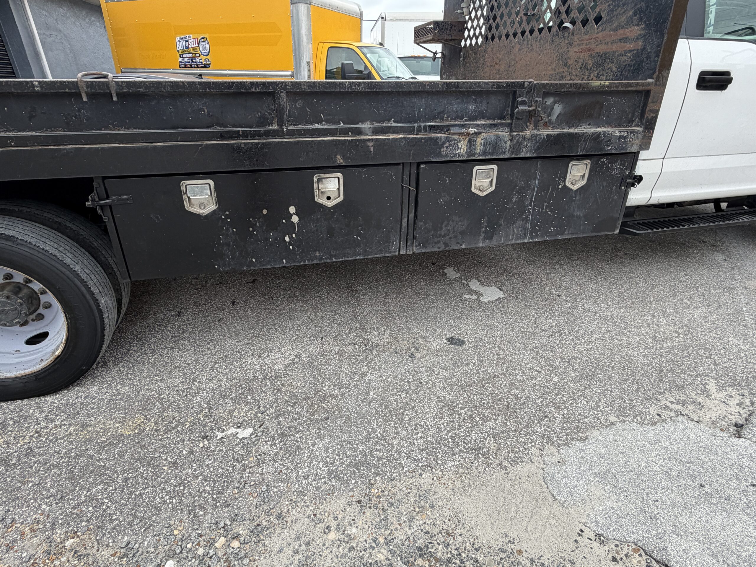 2019 Ford F-550 stake body truck with storage compartments