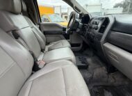 2019 Ford F-550 Super Duty truck interior with gray seats and dashboard.