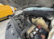 2019 Ford F-550 stake body engine bay with 6.7L PowerStroke diesel